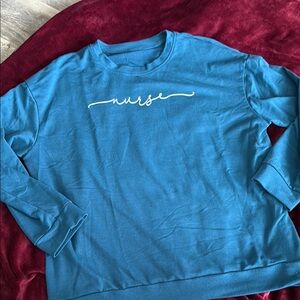 Blue Crewneck Sweater with Nurse Script Design